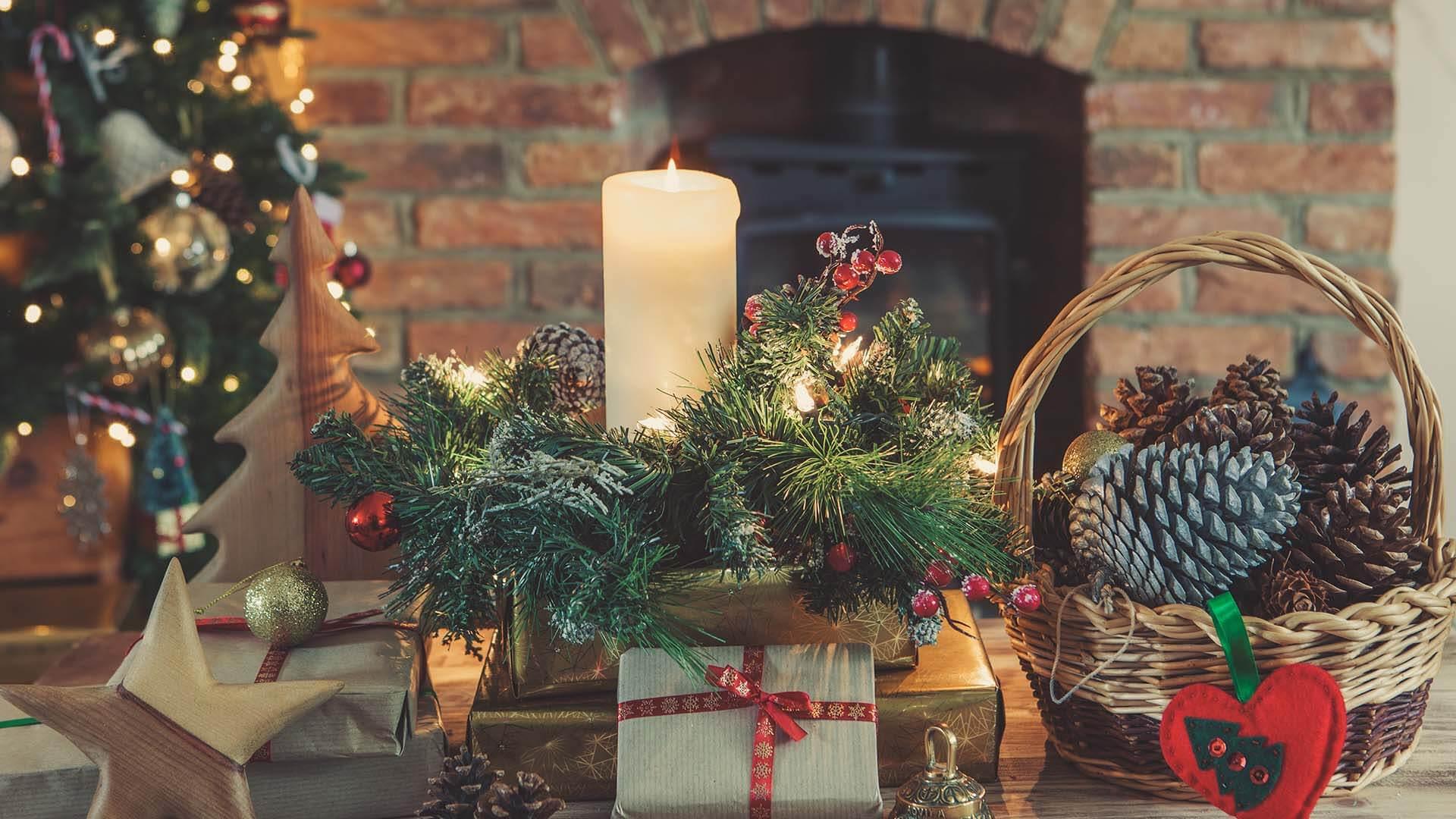 Holiday paraphernalia in front of a fireplace